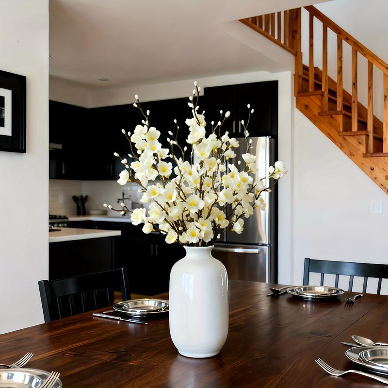 artificial white plum blossom branches with silk petals arranged for spring vase decor