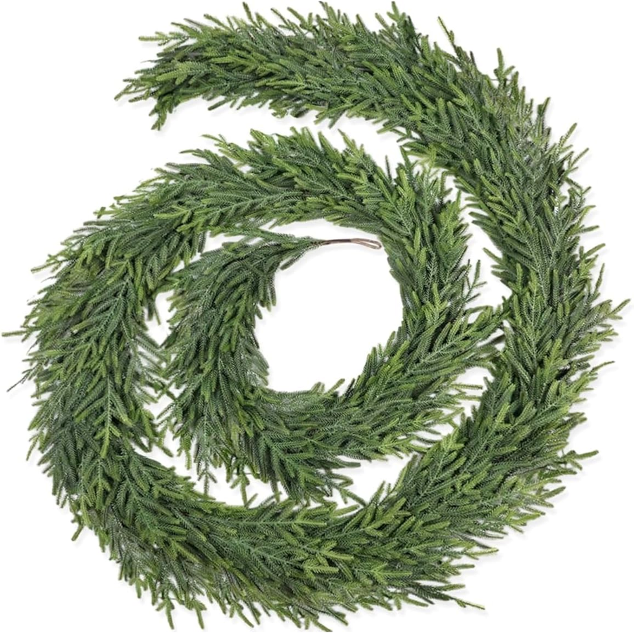 Coiled green artificial pine garland showing its connected foliage and flexible display shape